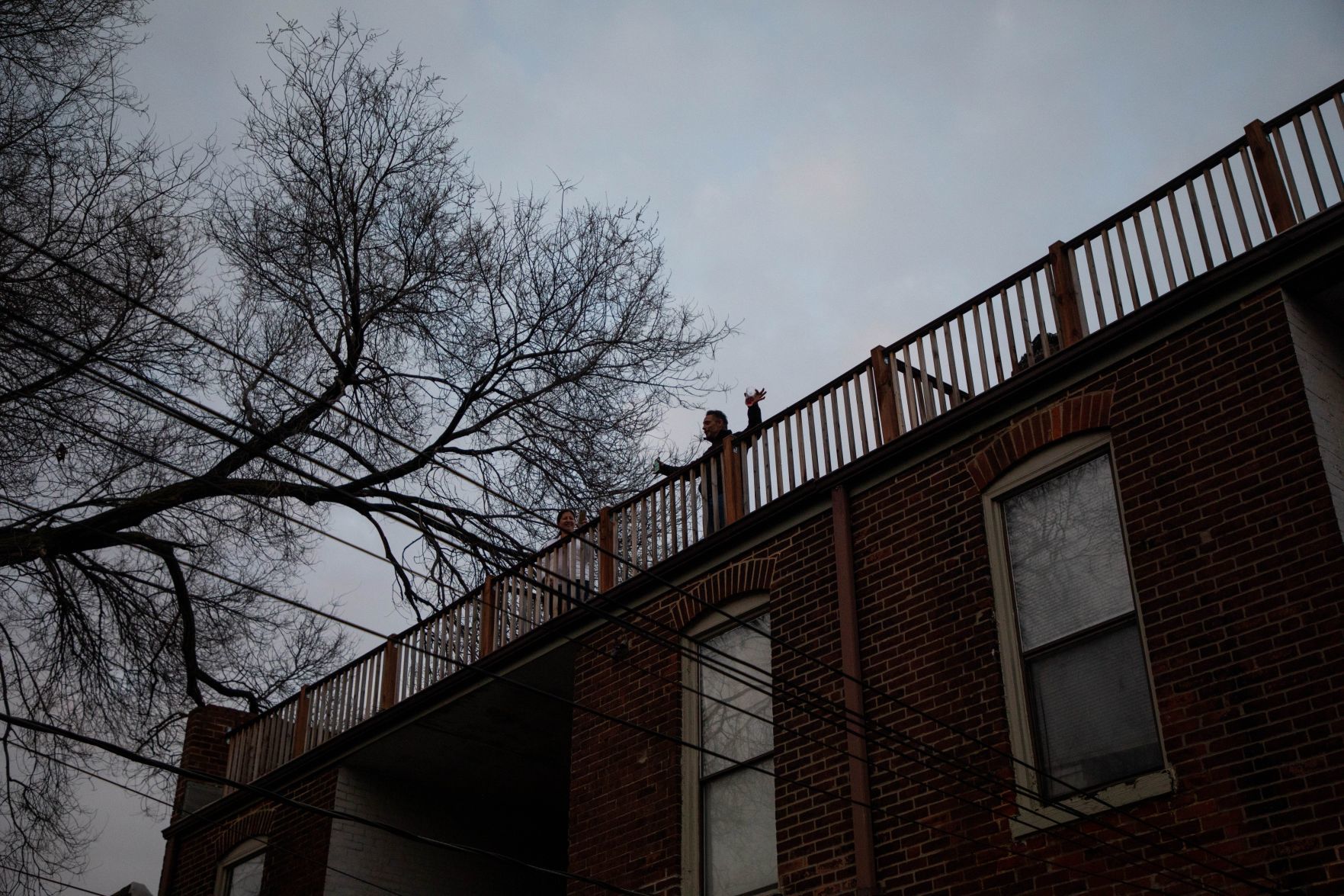 Man brings neighbor together in the wake of socical distancing to sing a song from his balcony every night